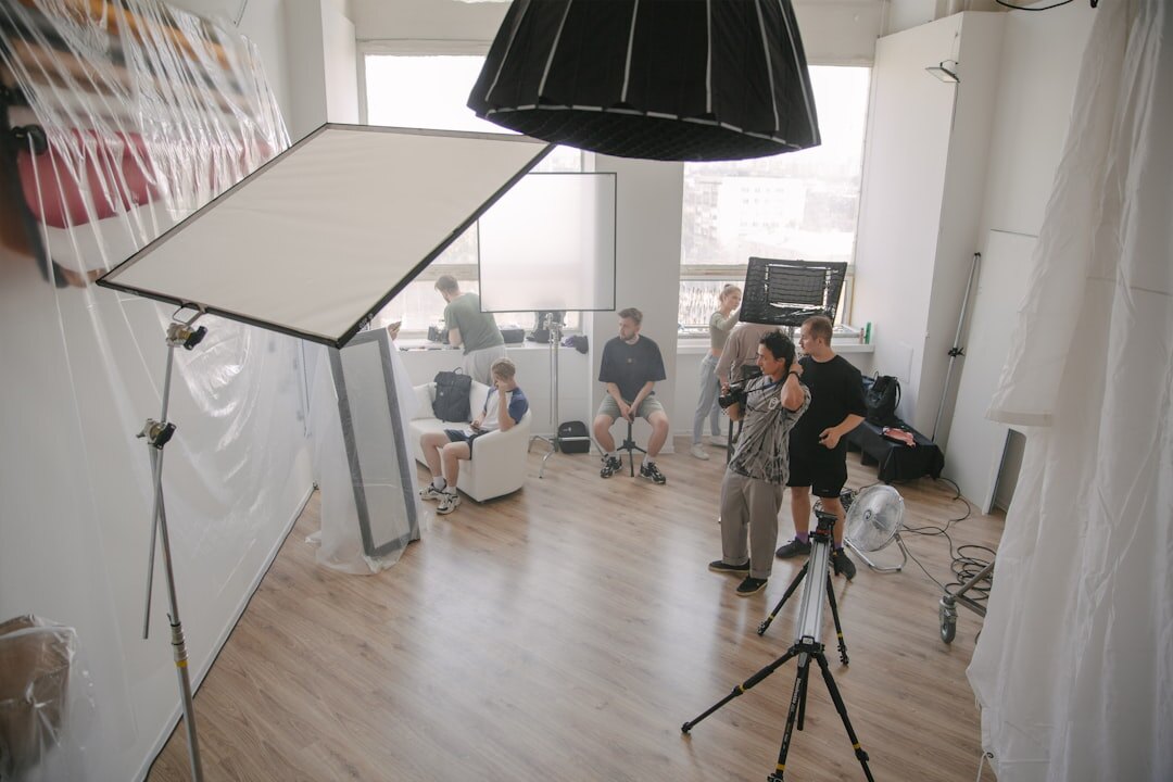 Diverse production team meeting around a table in a studio